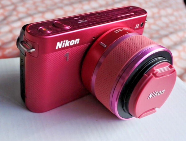 Pink Nikon 1 J2 camera.  Boxed with 10-30mm & 30-110mm lenses, battery & charger